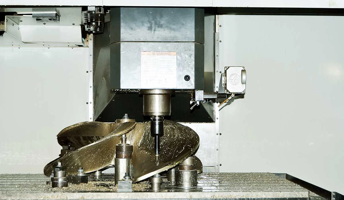 Bronze marine propeller undergoing CNC machining