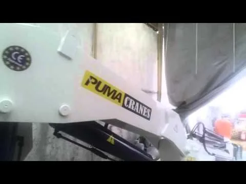 Official video thumbnail showing a telescopic marine crane operating on a vessel