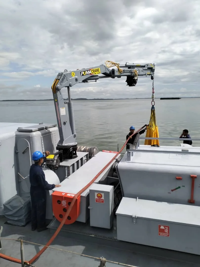 White marine crane arranged for yacht-tender handling